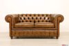 Canapé Chesterfield en cuir antique marron avec effet d'occasion