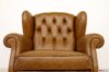 Fauteuil capitonné dossier bergère cuir