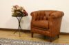 Fauteuil de chambre d'hôtel en cuir brun
