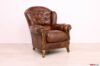 Fauteuil classique en cuir brun et bois