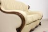Accoudoir de canapé en cuir de luxe et bois sculpté